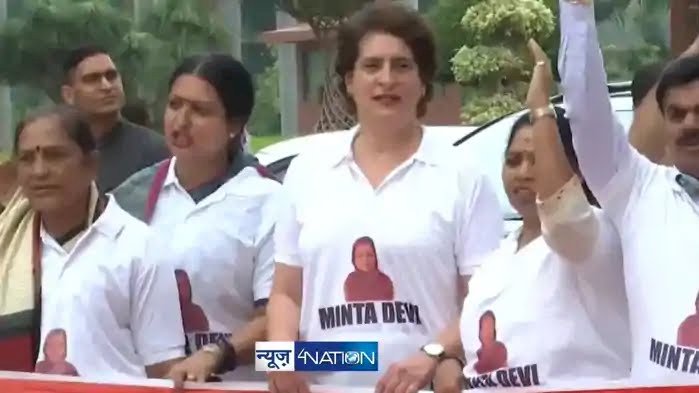124 वर्षीय मतदाता पर हंगामा:प्रियंका गांधी की टी-शर्ट में खुद की फोटो देख भड़कीं मिंता देवी, बोलीं- 'वो कौन होती हैं, मेरा नाम क्यों